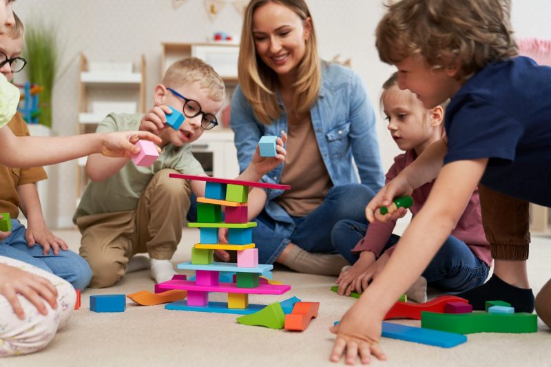 children-playing-with-toy-blocks-in-the-kindergarten.jpg